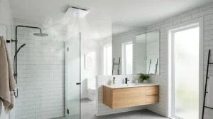 Modern bathroom with a properly sized ceiling exhaust fan removing steam after a shower.